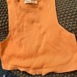 Orange ZARA crop top.